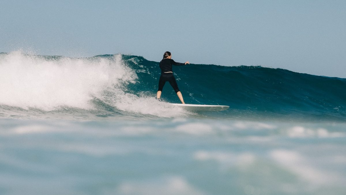 Tori Horton surfing